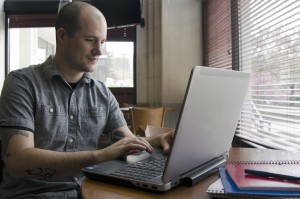 A student working at a laptop