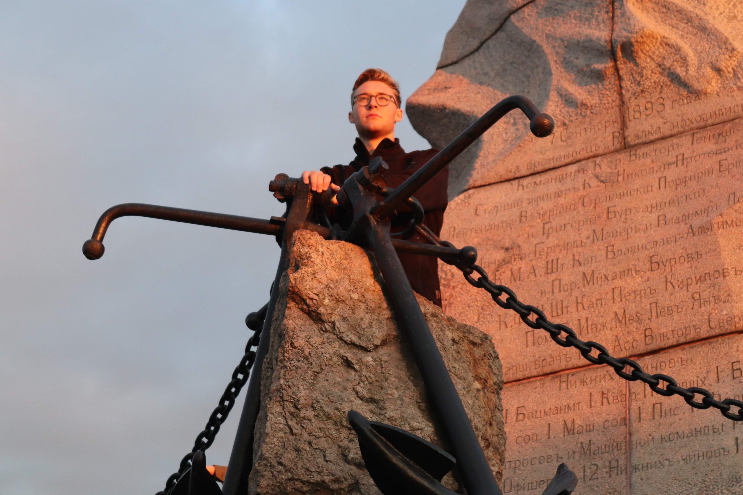 Mason on top of a chained rock