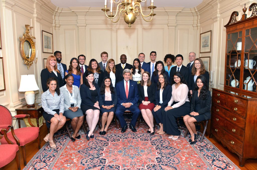 Rebecca Rumptz and a large group of people pose for a picture