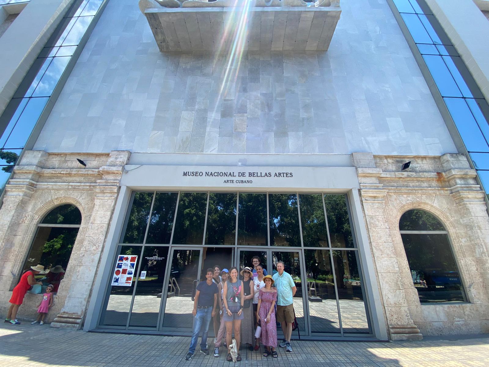 a group of people in front of a museum