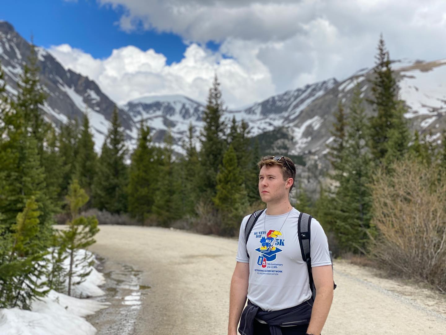 Mason in front of a snow capped mountain