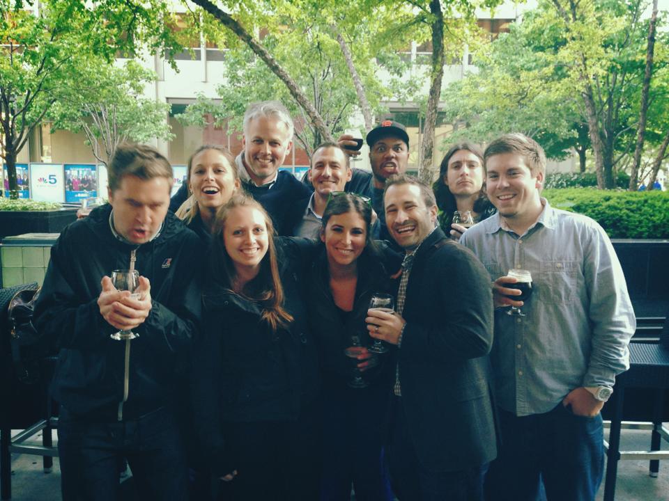 kris with a group of people having drinks on a patio