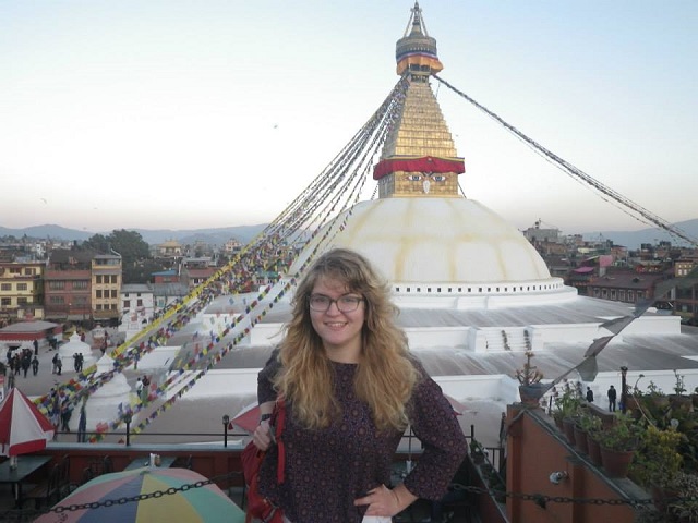 Abigail in front of a pagoda in India