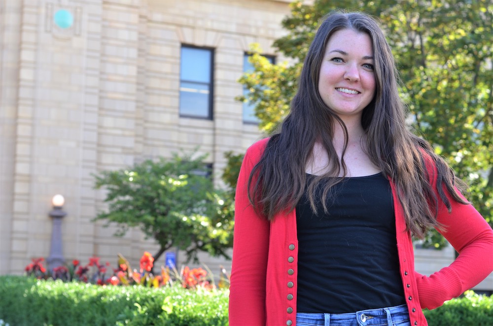 Rachel Smith in front of Strong Hall