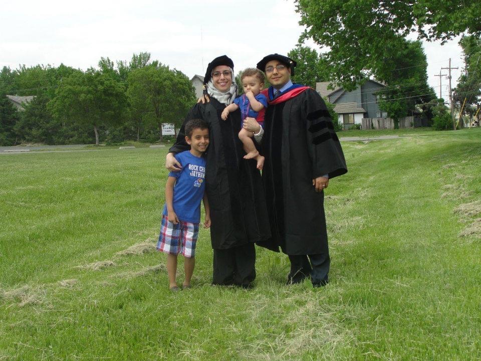 Heba Mostafa with family in graduation regalia