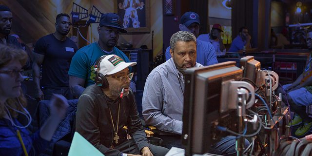 Kevin Willmott and Spike Lee looking at a monitor