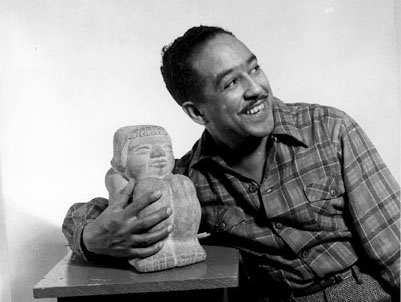 Langston Hughes with a statue