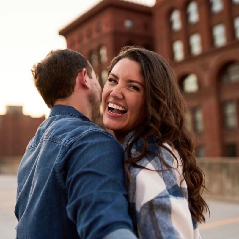 madeline smiling while hugging someone