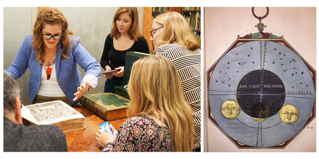 Stephanie opens a book for visitors to look at, and an eclipse wheel chart