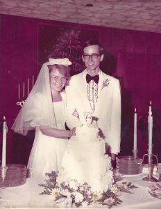 Clyde and Nancy Toland at their wedding celebration in Watkins Room of the Kansas Union.