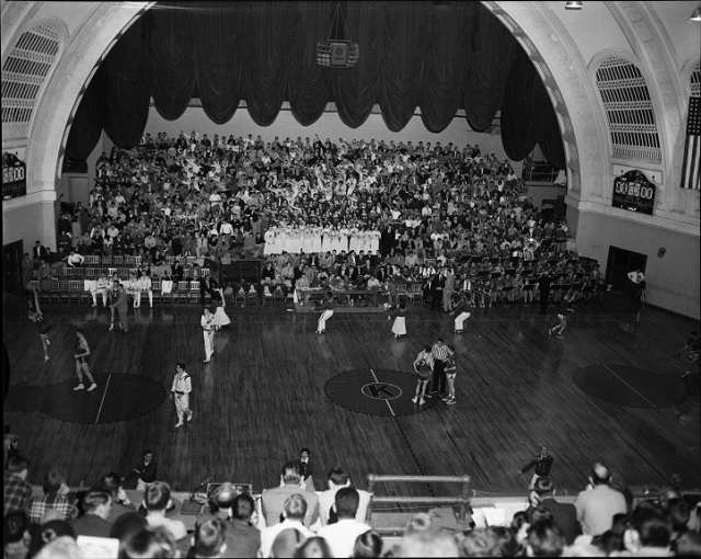 a basketball game being played in Hoch Auditorium