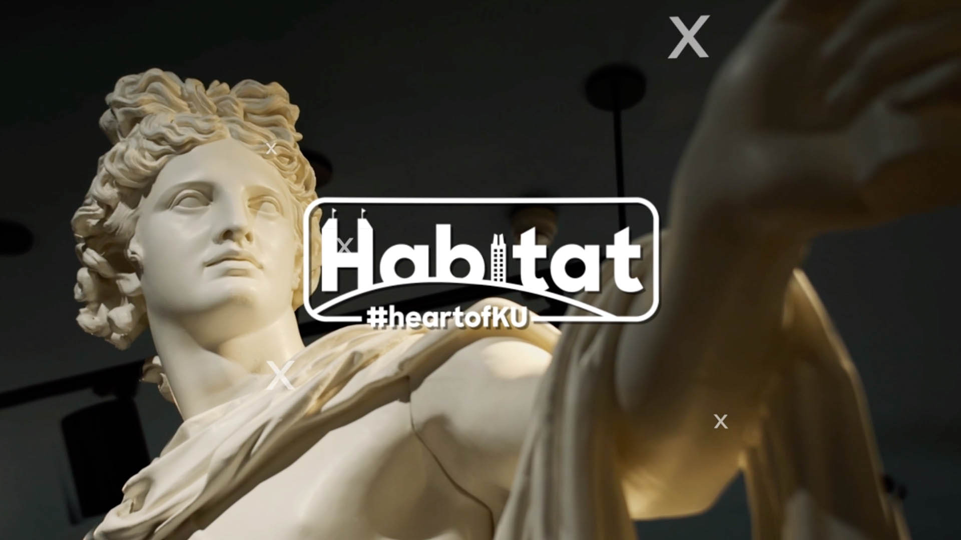 A poster with a statue and Habitat logo