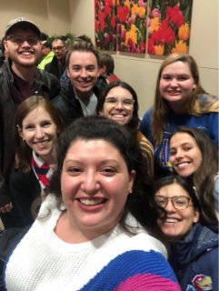 a group of people smiling for a selfie