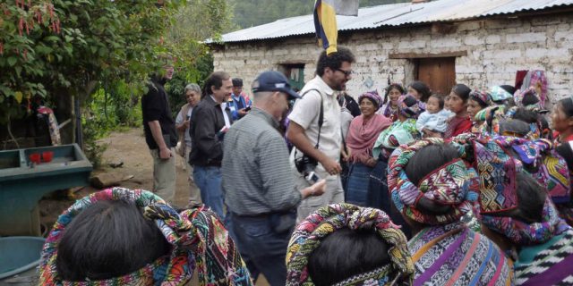 Carlos going through a South American village