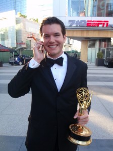 Chris Martin holding an Emmy