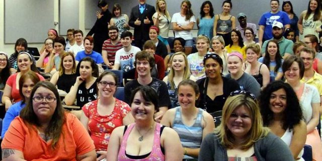 An image of around 30 students inside a women, gender and sexuality studies classroom. 