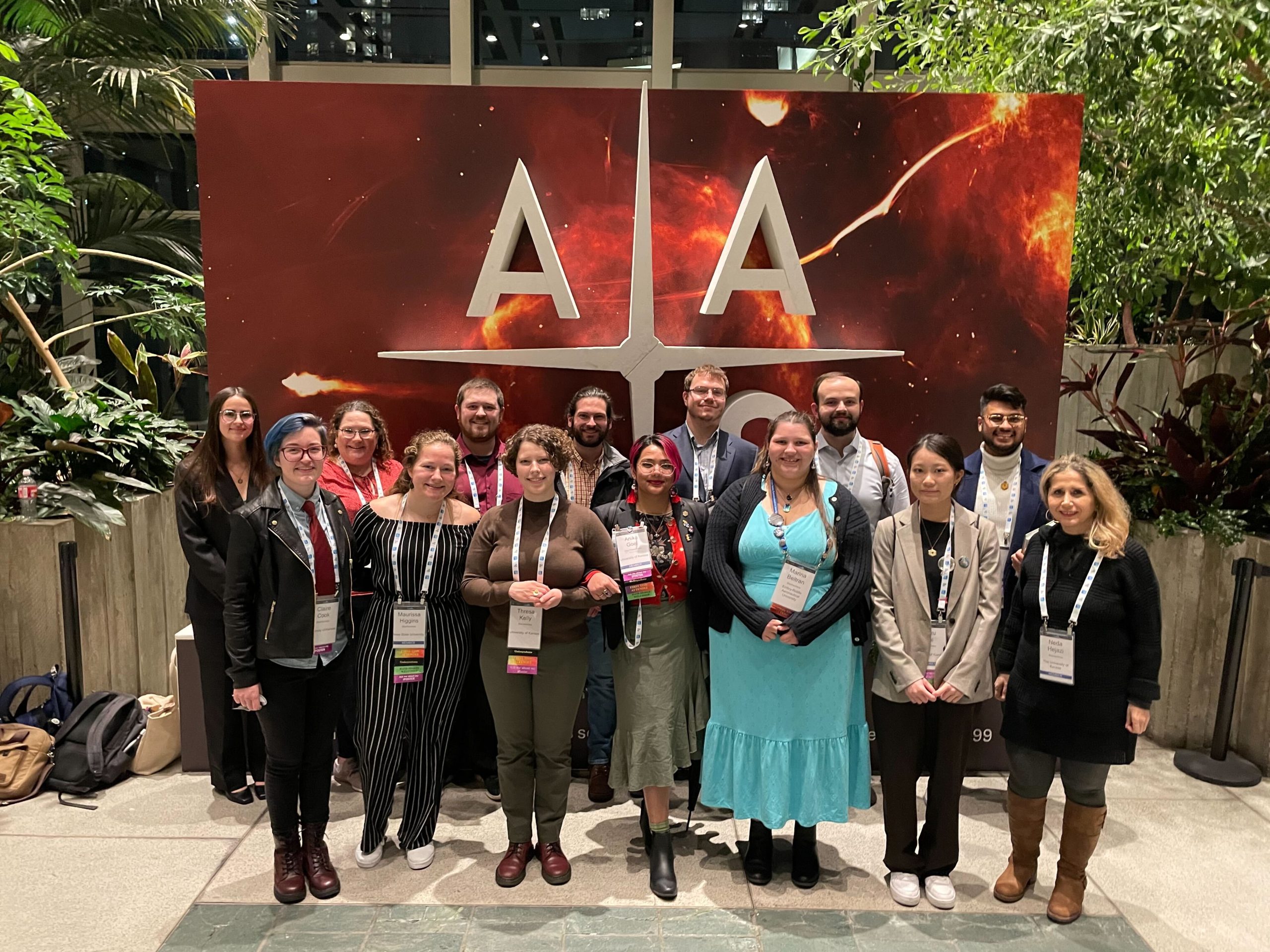 A group of people posing for a photo at the American Astronomical Society meeting