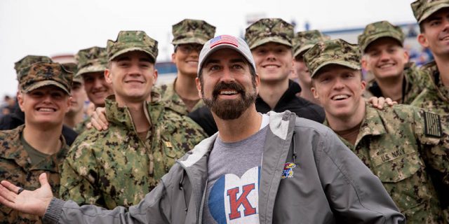 Rob Riggle with soldiers in uniform