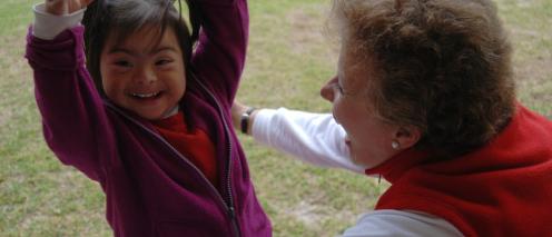 Liliana Mayo smiling with a student
