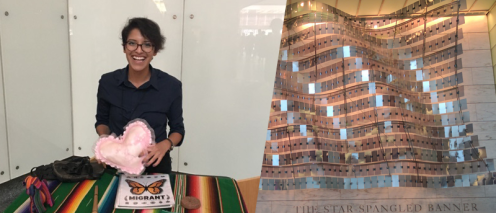 Sandra Sanchez holds a pink heart and a sculpture called the Star Spangled Banner that is reflective metal panels