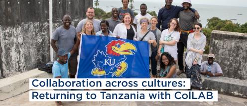 people posing with KU flag