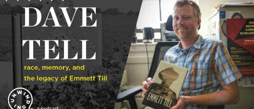 Photo of Dave Tell holding an Emmet Till book
