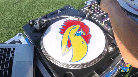 Turntable with a jayhawk record spinning. 