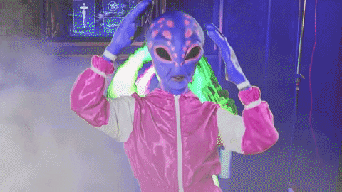 Alien in jacket dancing. 